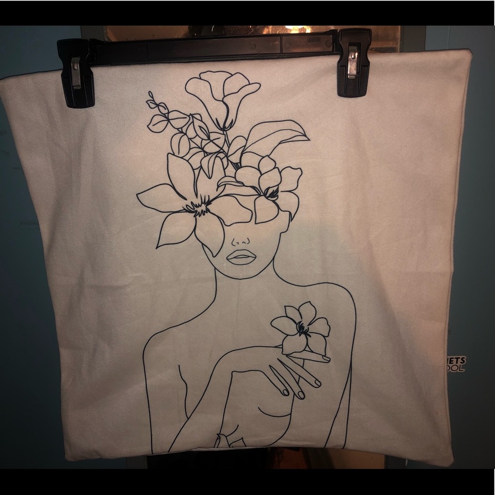 White pillow case with a woman & flowers